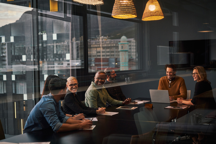 Experienced business professionals meeting to discuss a transaction