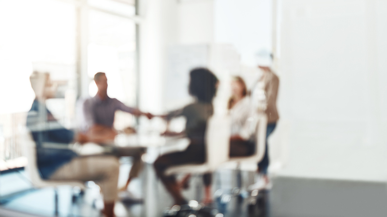 Business professionals meeting to discuss and resolve a commercial dispute