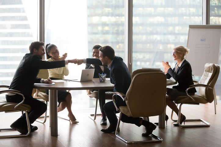 Business professionals reaching agreement during the completion of an Asset Purchase